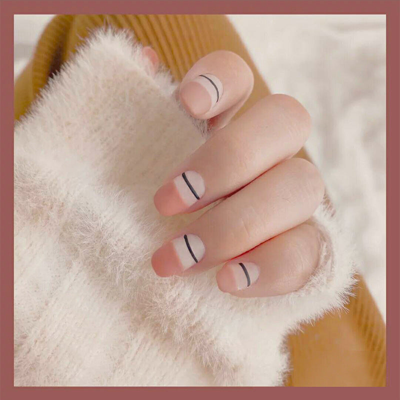 Cozy Minimalist Medium Length Squoval Soft Pink Nails with Elegant Black Line Detail