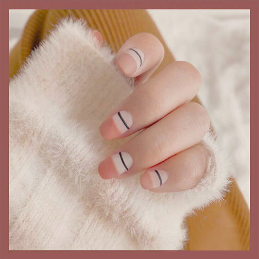 Cozy Minimalist Medium Length Squoval Soft Pink Nails with Elegant Black Line Detail