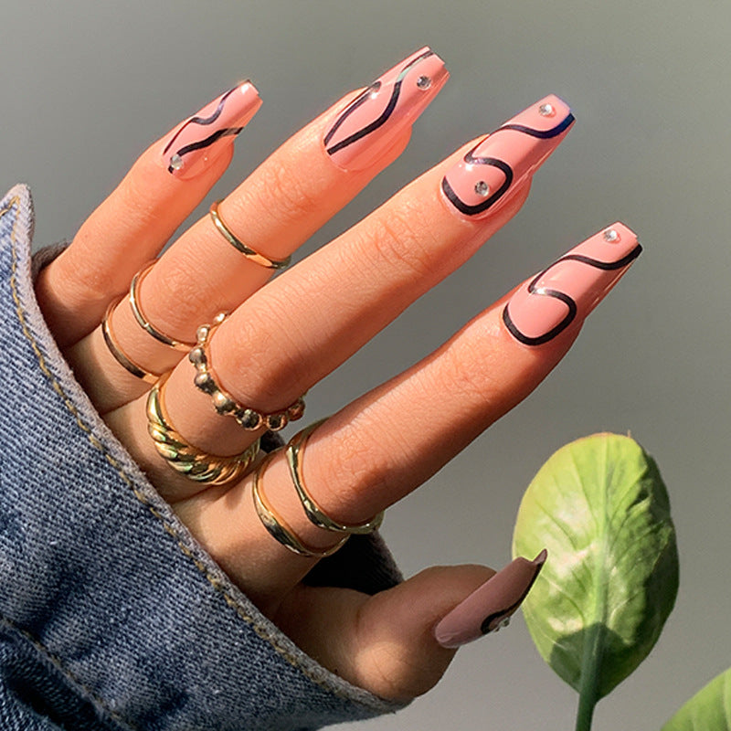 Elegant Swirls Long Coffin Peach and Black Press-on Nails with Rhinestone Accents
