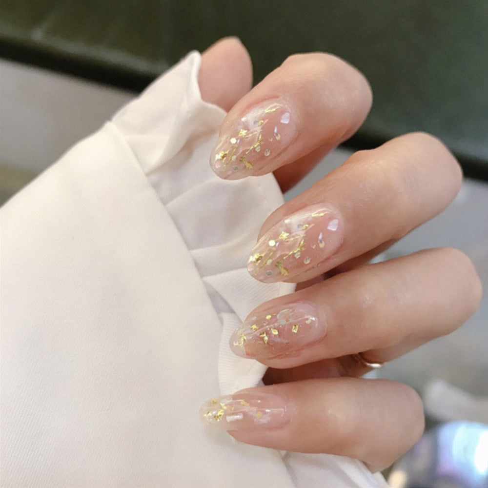 Glistening Garden Inspired Medium Almond Shaped Transparent Nails with Shimmering Gold Accents