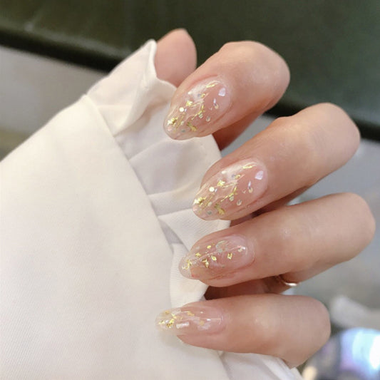 Glistening Garden Inspired Medium Almond Shaped Transparent Nails with Shimmering Gold Accents