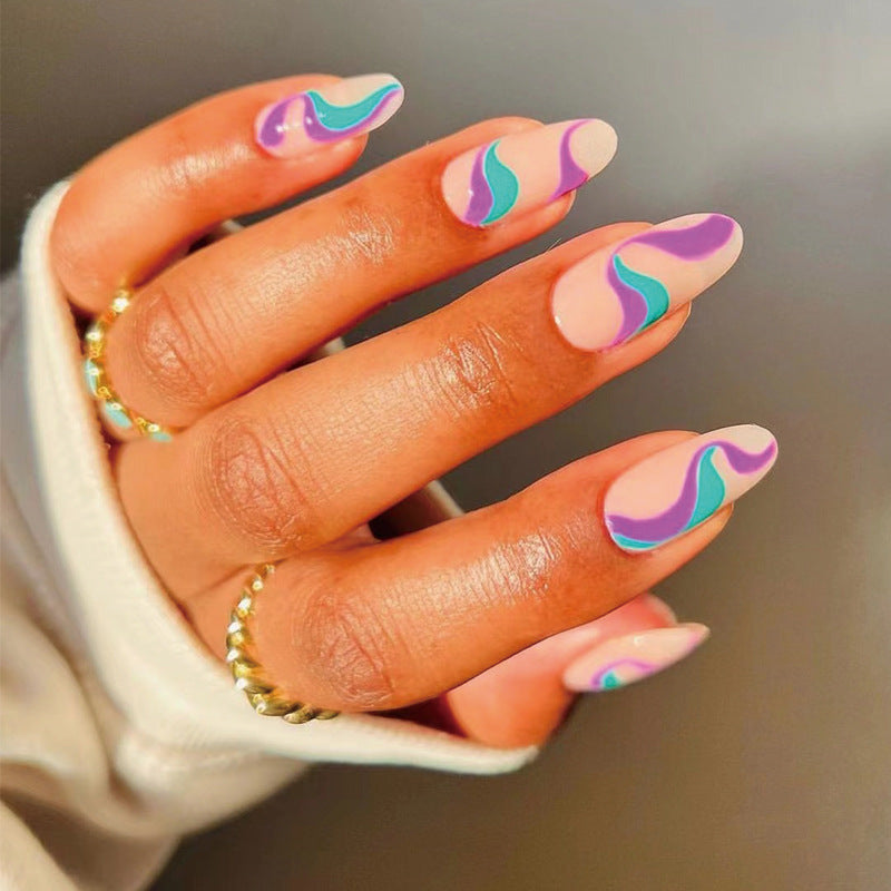 Whimsical Wave Design Medium Almond Shaped Peach Purple and Teal Press on Nail Set with Unique Swirl Patterns