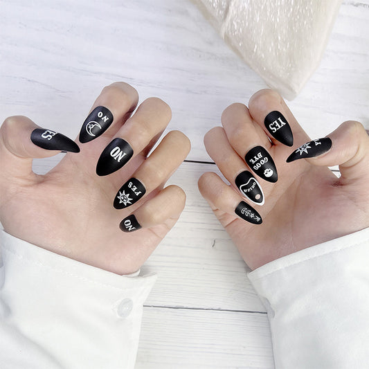 Mystical Night Black Long Almond Press On Nail Set with Unique Statement Designs and Matte Finish