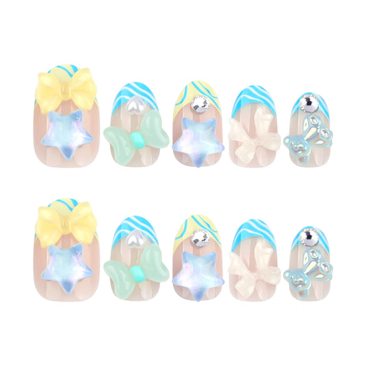 A set of pastel-colored false nails with iridescent bow and star accents.