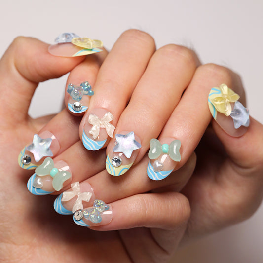 Whimsical Ocean Breeze Short Round Shaped Light Blue and Pastel Press on Nail Set with Charming Decorative Elements