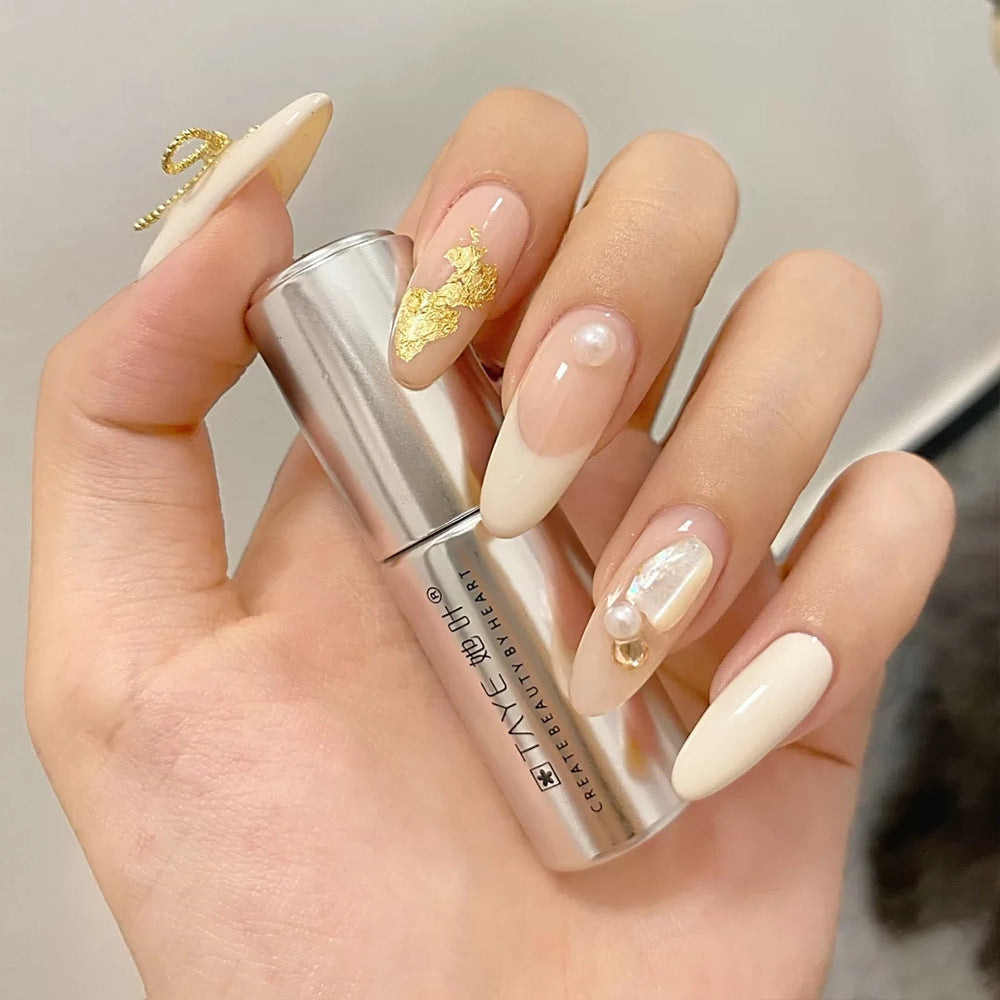 Glamorous Elegance Long Oval Creamy Nail Set with Gold Leaf Accents