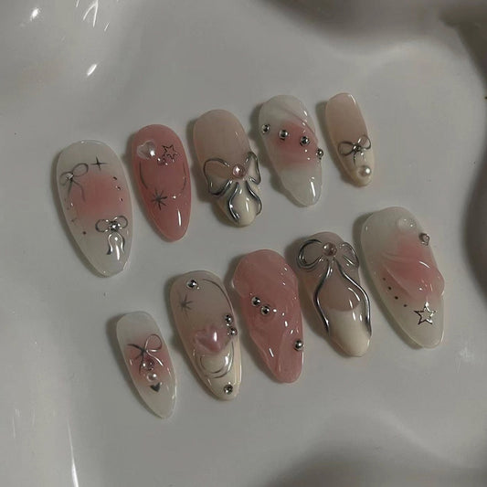 Elegant Marble Bliss Medium Almond Pink Press On Nails with Silver Embellishments and Charms