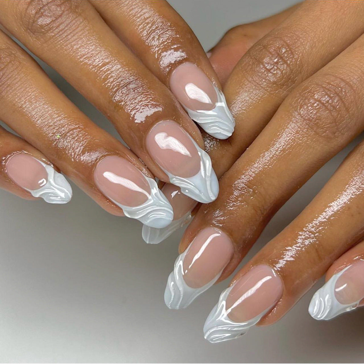 Elegant Waves Collection: Medium Almond Pink Press On Nails with White Swirl Accents