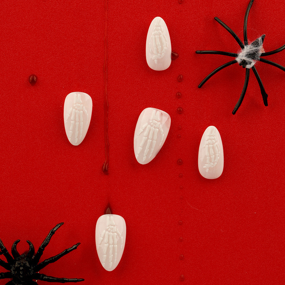 Halloween Haunt Medium Almond Ivory Press On Nails with Embossed Skeleton Design