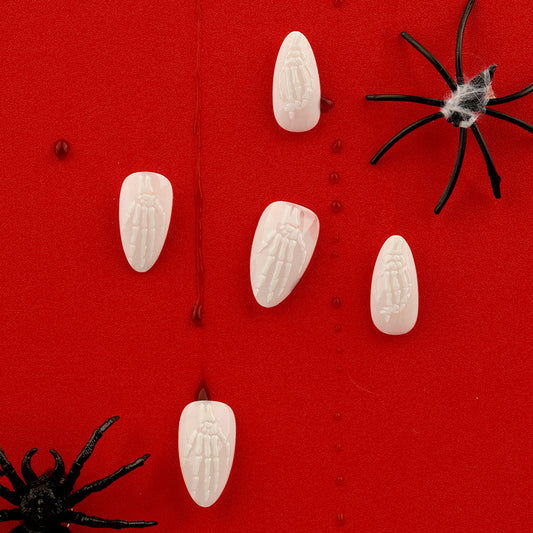 Halloween Haunt Medium Almond Ivory Press On Nails with Embossed Skeleton Design