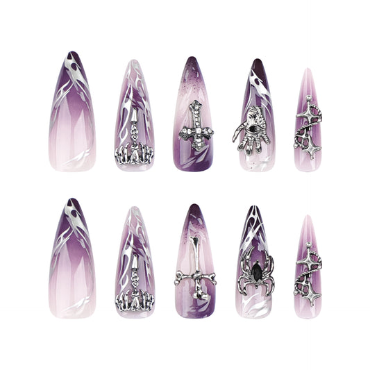 Set of decorative nail tips with purple and silver designs on a white background