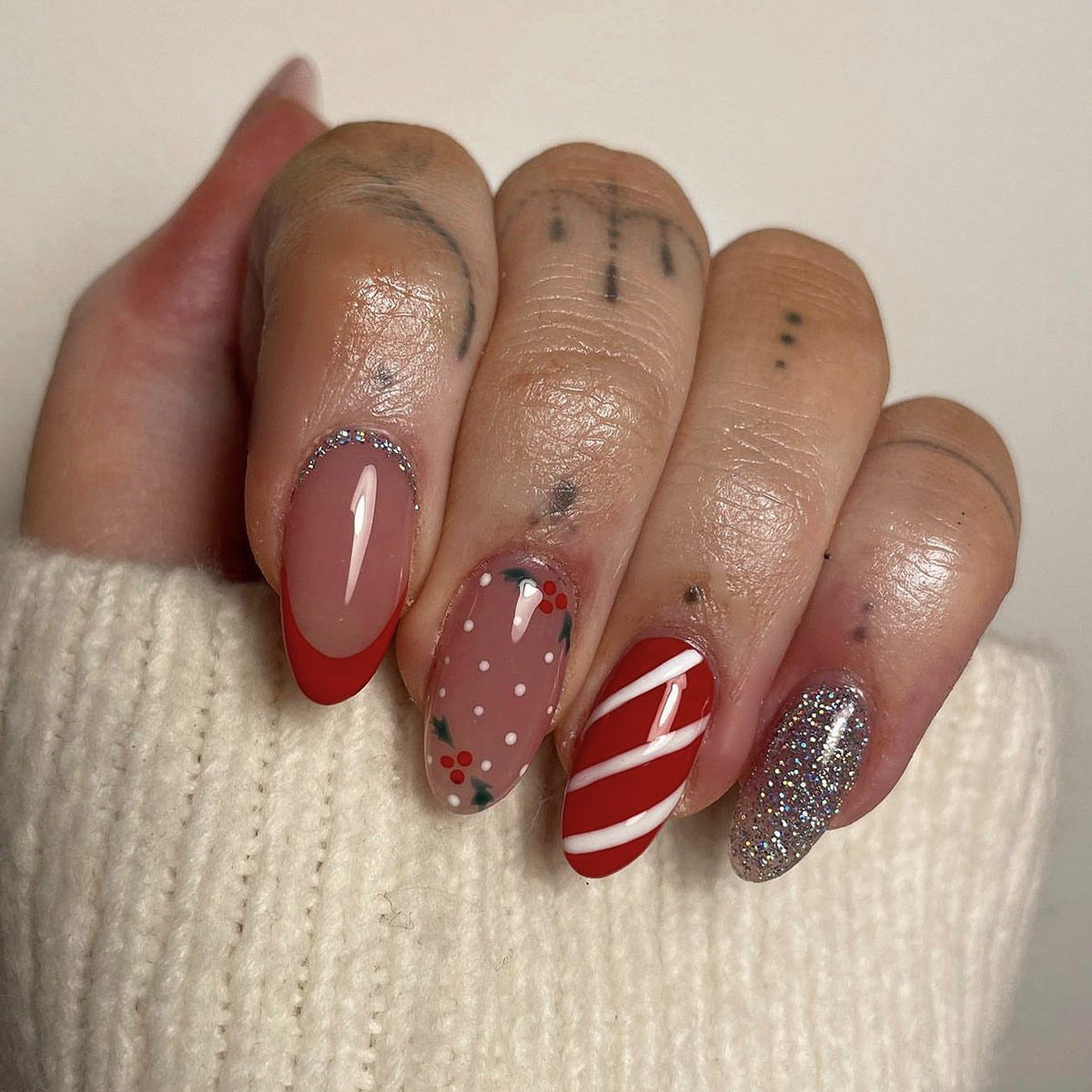 Festive Holiday Almond Medium Length Red and Beige Press On Nail Set with Glitter and Candy Cane Design