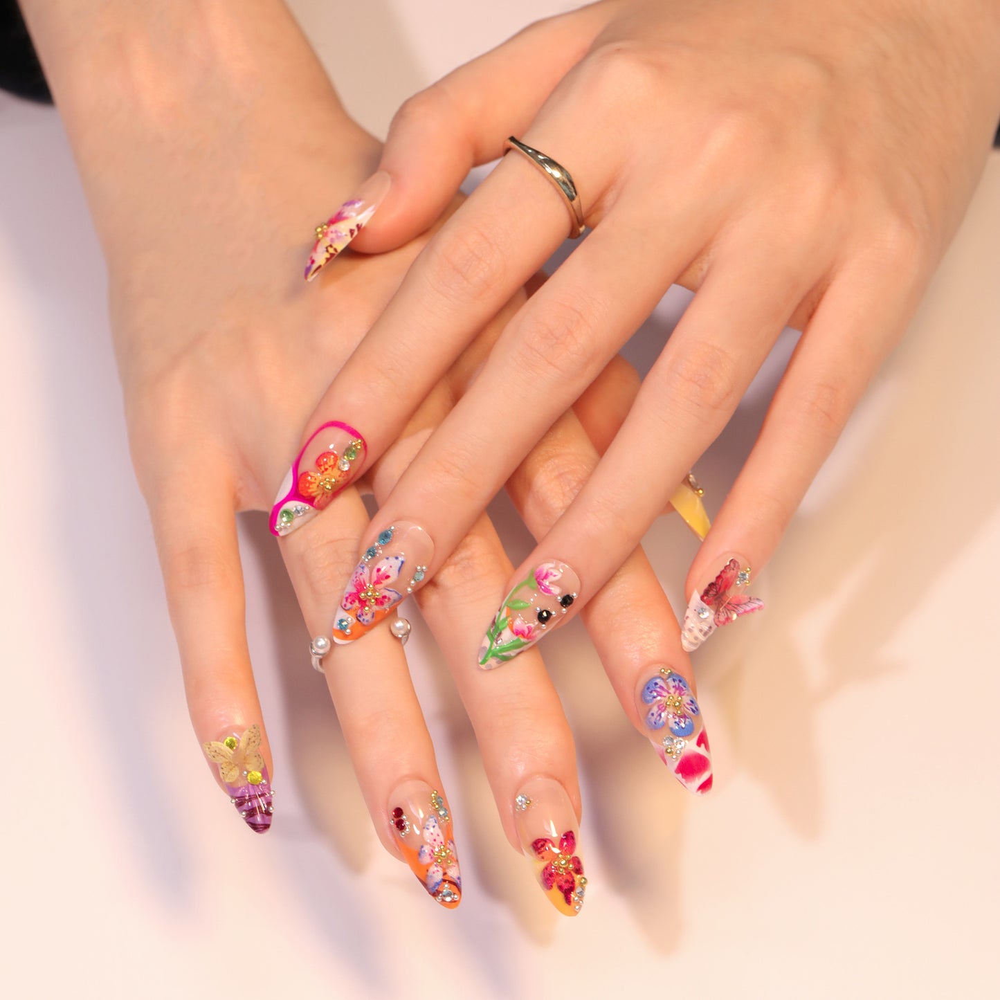 Whimsical Garden Fantasy Long Almond Colorful Floral Press On Nail Set with Sparkling Gem Accents