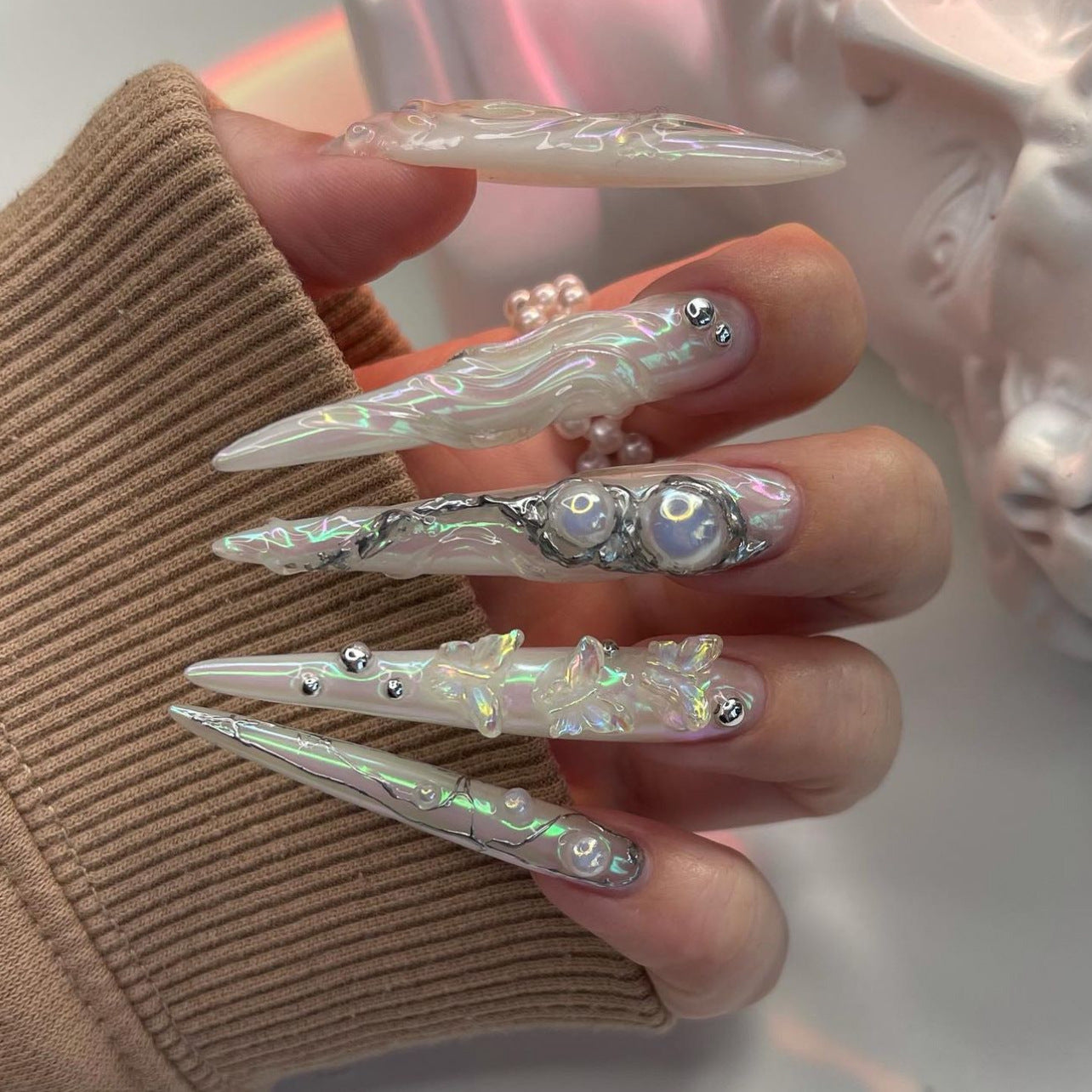 Celestial Elegance Long Stiletto Iridescent Nails with Unique Pearl and Floral Accents