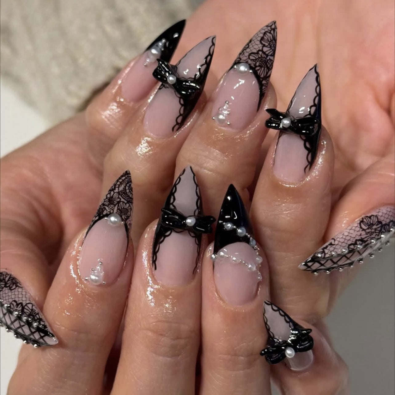 Chic Elegance Long Stiletto Black and Clear Press On Nail Set with Lace and Bow Accents