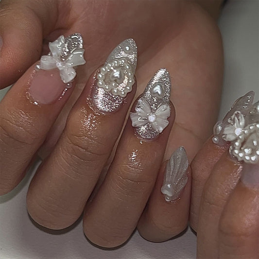 Whimsical Elegance Short Almond Sharp White Press On Nail Set with Floral Accents and Shimmering Detail