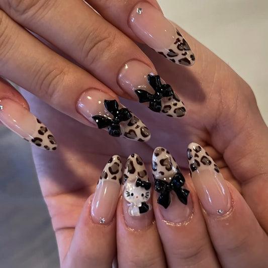 Whimsical Wildcat Long Almond Leopard Print Press On Nail Set with Charming Bow Accents