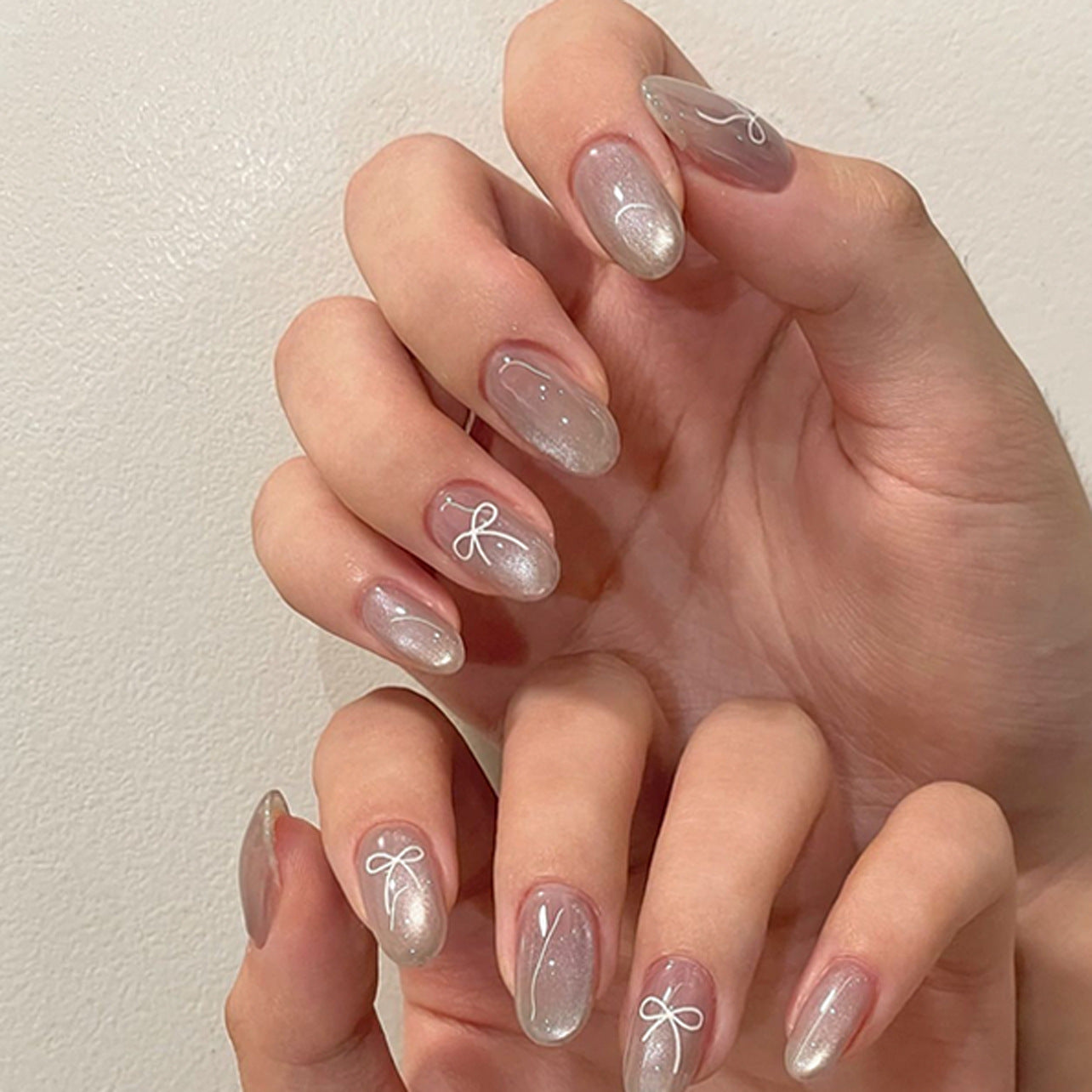 Dreamy Elegance Medium Round Shape Translucent Grayish Pink with Delicate White Bow Accents Press-On Nail Set