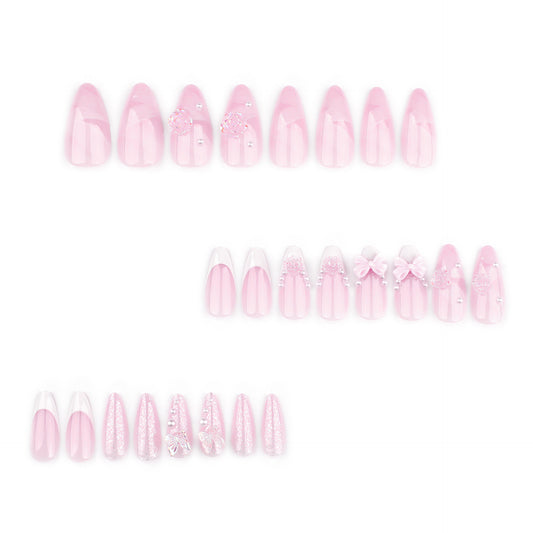 Lovely Petal Whimsy Short Almond Pink Press on Nail Set with Floral Embellishments and Shimmering Accents
