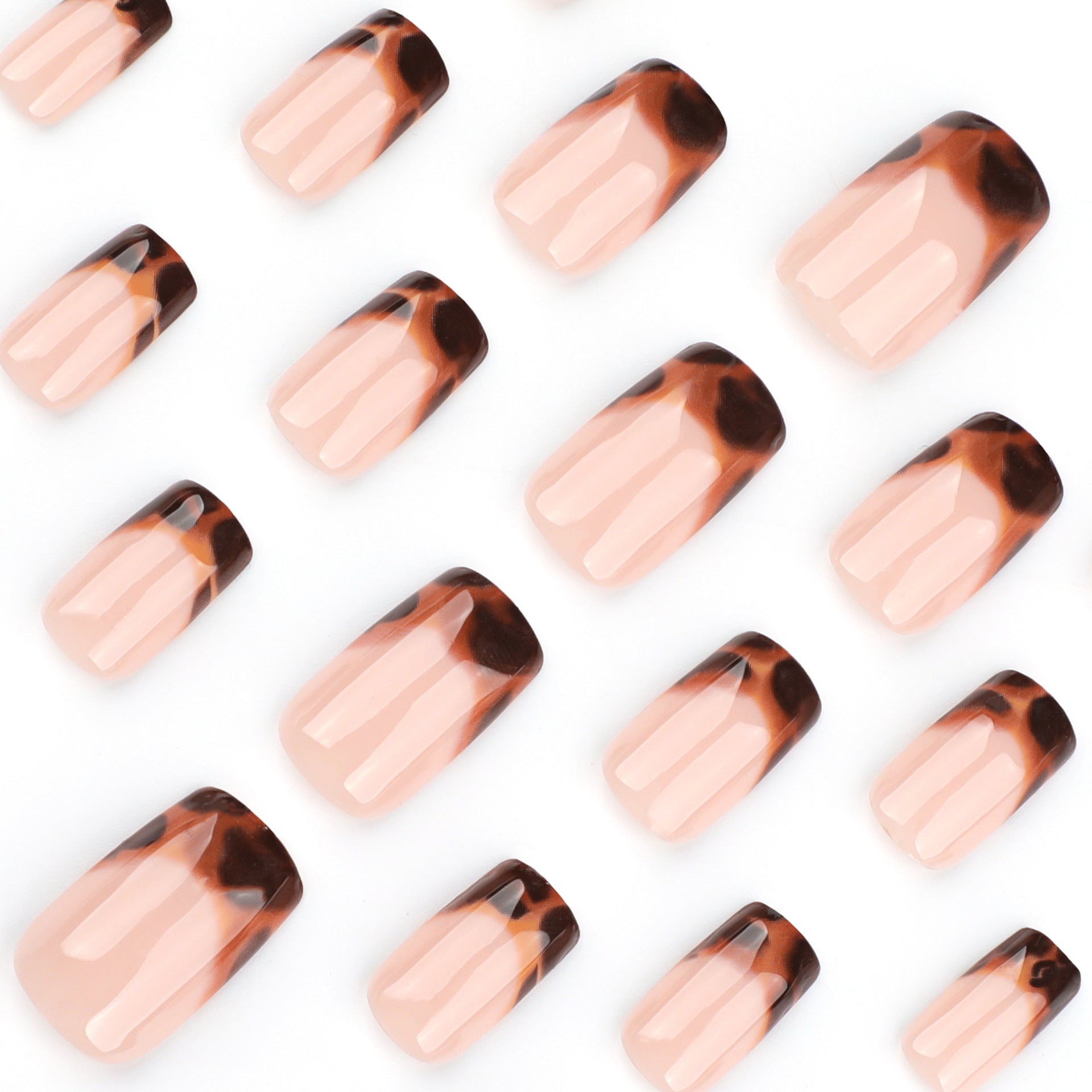 Pattern of tortoiseshell and nude nail designs on a white background