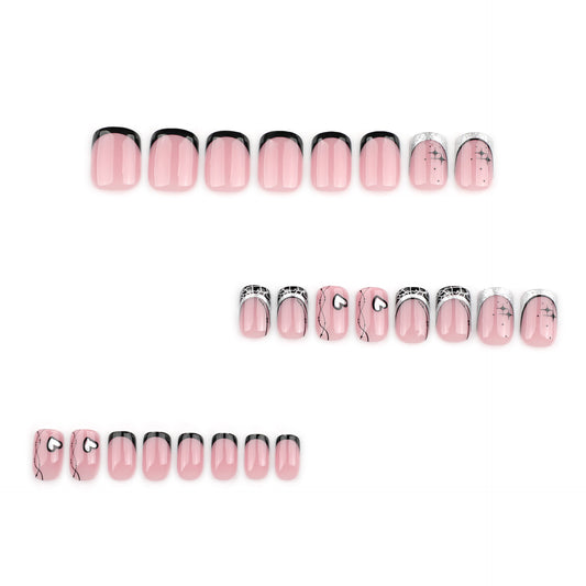 A set of press-on nails featuring a square shape with a pink base and black accents around the rim, with glitter applied at the tips.