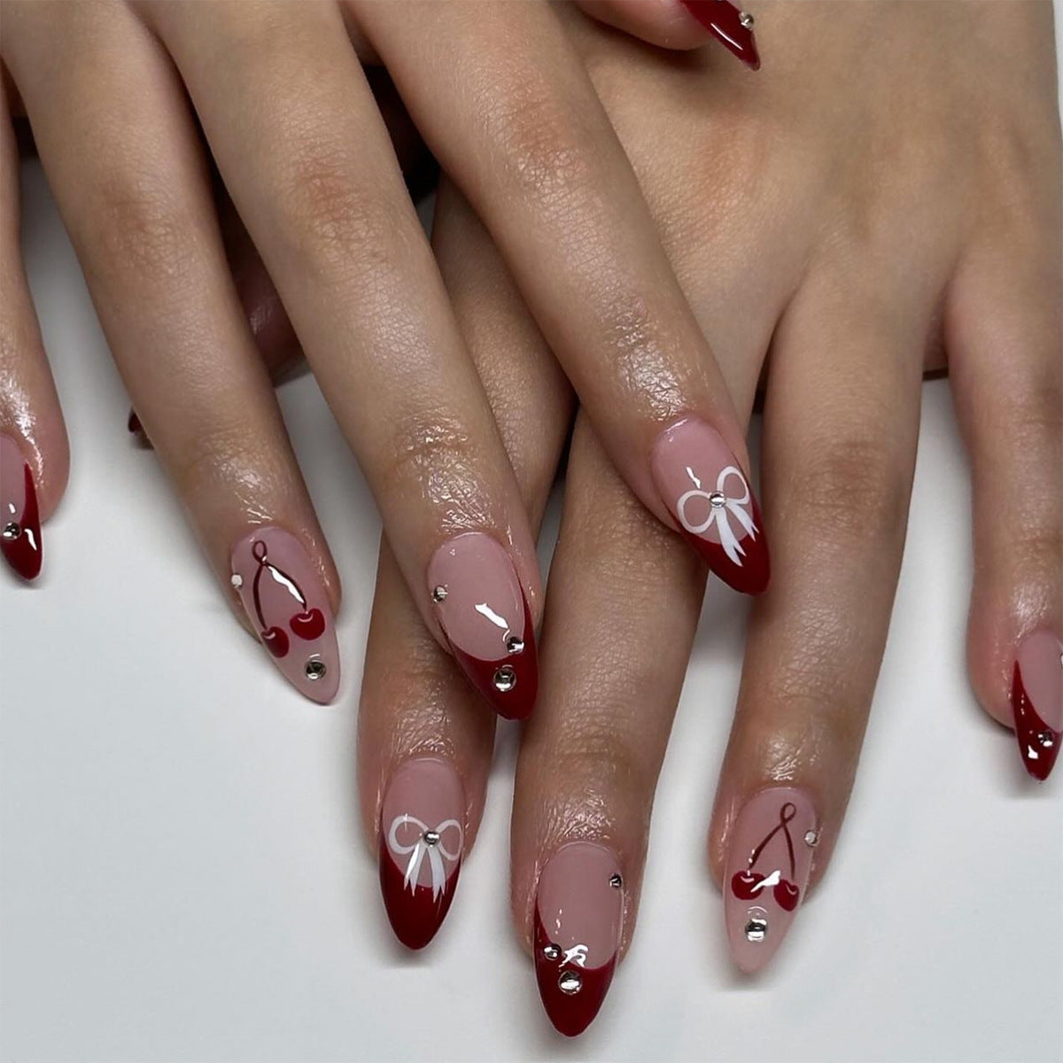 Cherry Blossom Inspired Medium Almond Red and Beige Press On Nail Set with Charming Bow and Jewel Accents