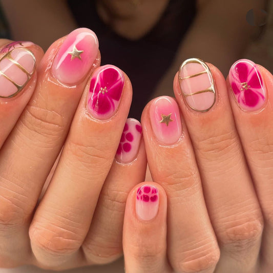 Floral Elegance Short Oval Pink Gradient Press On Nail Set with Gold Star Accents and Unique Petal Designs