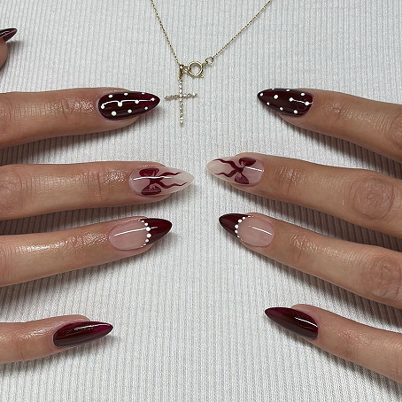 Chic Gothic Medium Stiletto Burgundy and Beige Press-On Nail Set Featuring Unique Abstract Design