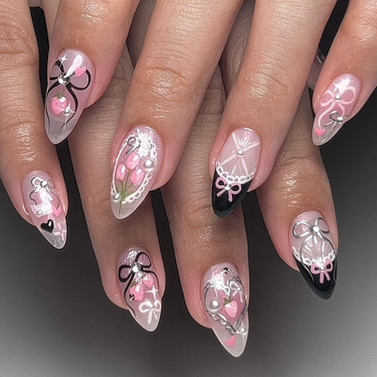 Whimsical Charm Medium Almond Pink and Black Press On Nail Set with Intricate Bow and Floral Designs