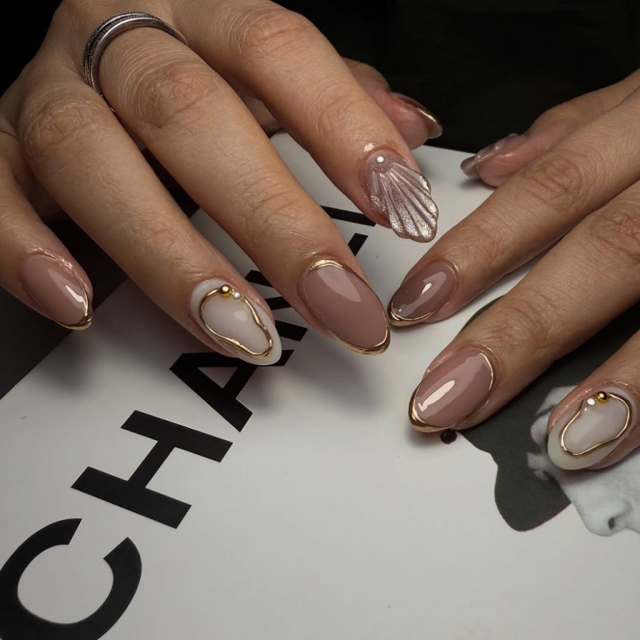 Elegant Oasis Extra Medium Almond Shaped Beige and White Press On Nail Set with Golden Detailing and Sea Shell Accent