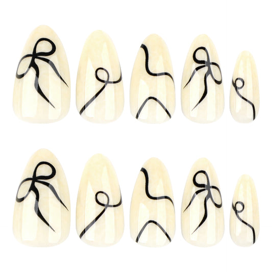 Elegant Ribbon Dreams Medium Almond Cream Press-On Nail Set with Striking Black Designs