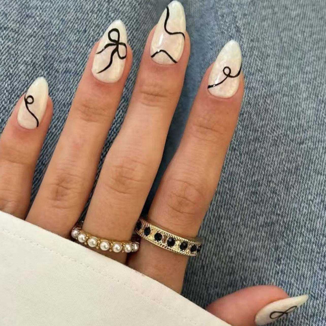 Chic Elegance Extra Medium Almond White Press on Nail Set with Unique Black Swirl Design