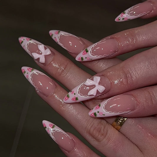 Whimsical Garden Medium Almond Pink Press on Nail Set featuring Charming Strawberry and Bow Designs