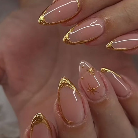 Celestial Elegance Medium Almond Pink Nails with Radiant Gold Tips and Star Accents
