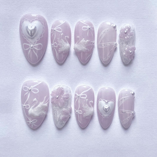 Whimsical Romance Long Almond Soft Lavender Nail Set with Heart and Swan Designs