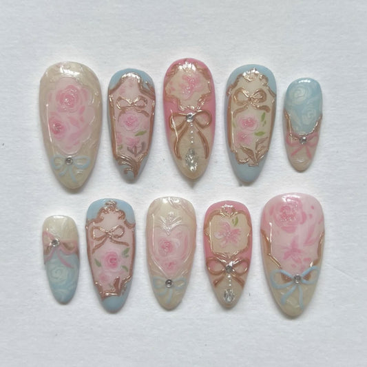 Whimsical Floral Dream Press On Nail Set Long Almond Pink and Blue with Elegant Gold Accents and Intricate Floral Designs