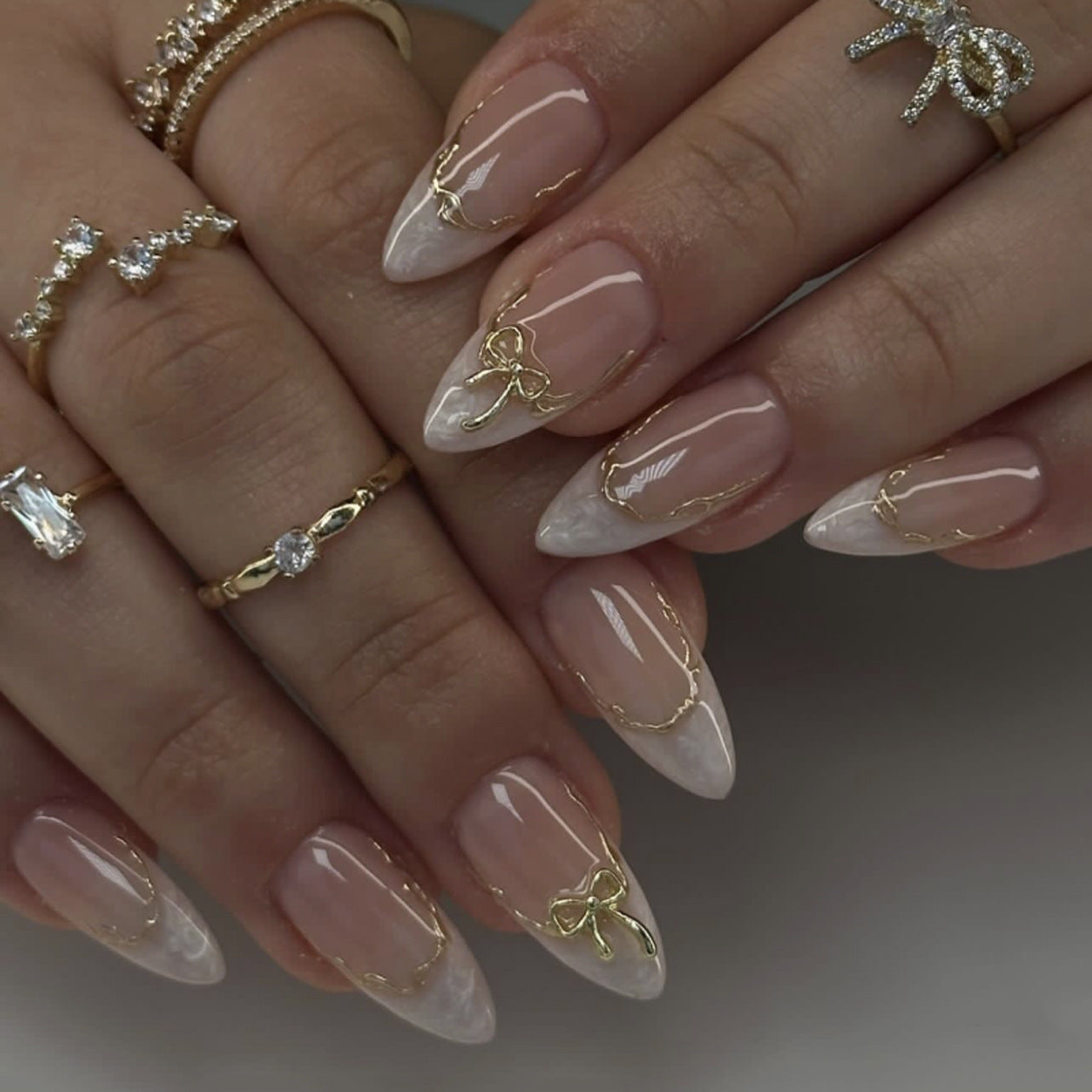 Elegant Whimsical Medium Almond Shaped White and Clear Press On Nail Set with Unique Gold Bow Accent