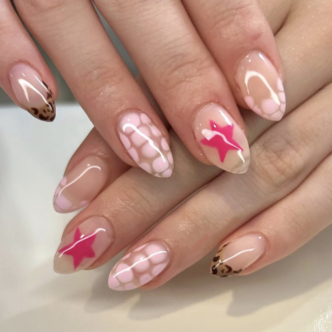 Chic Glamorous Medium Almond Shaped Soft Pink with Animal Print and Star Detail Press On Nail Set
