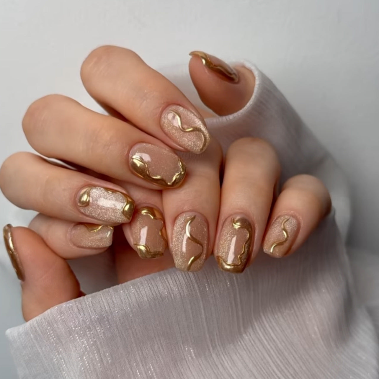 Glamorous Elegance Short Square Beige Nails with Metallic Wave Detailing