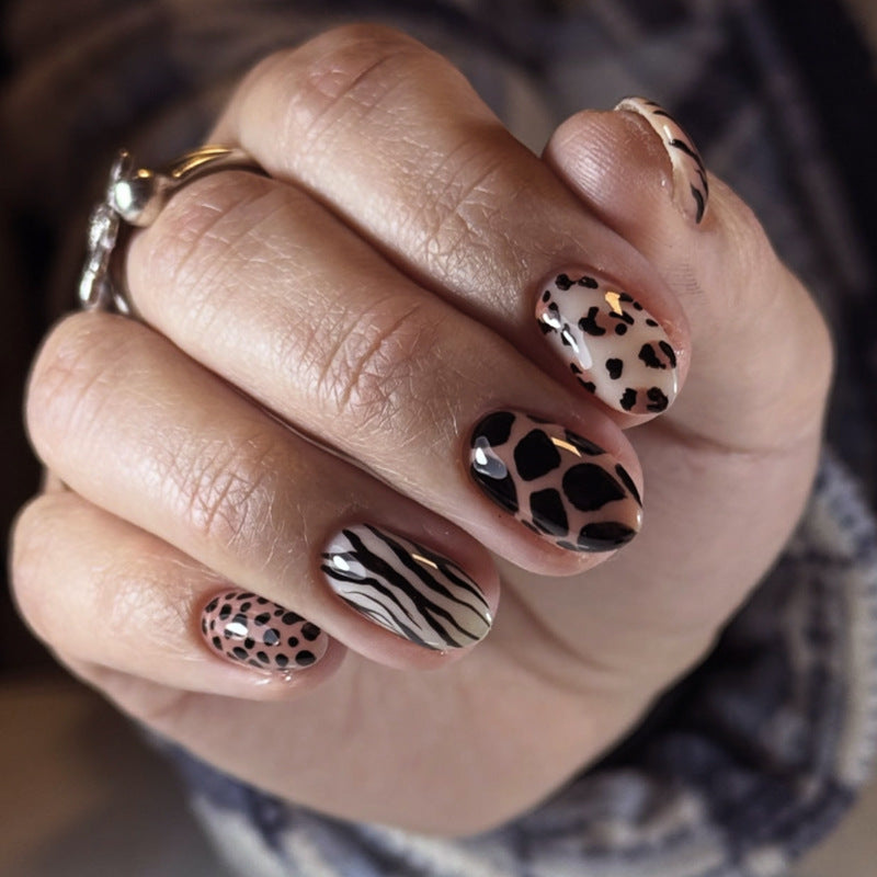 Safari Chic Medium Oval Pink and Black Animal Print Press On Nail Set with Glossy Finish