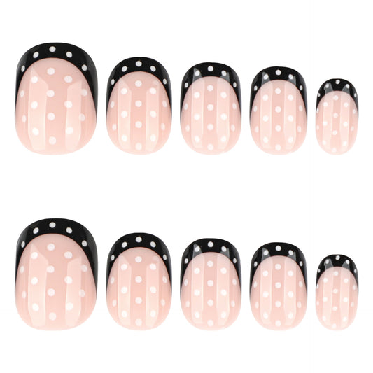 Chic Polka Dot Press-On Nail Set in Short Squoval Shape Blush Pink with Striking Black Tips and Delightful White Dots