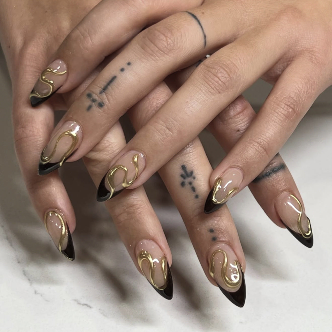 Glamorous Nightfall Elegant Long Almond Press On Nail Set in Ombre Black with Unique Gold Swirl Design