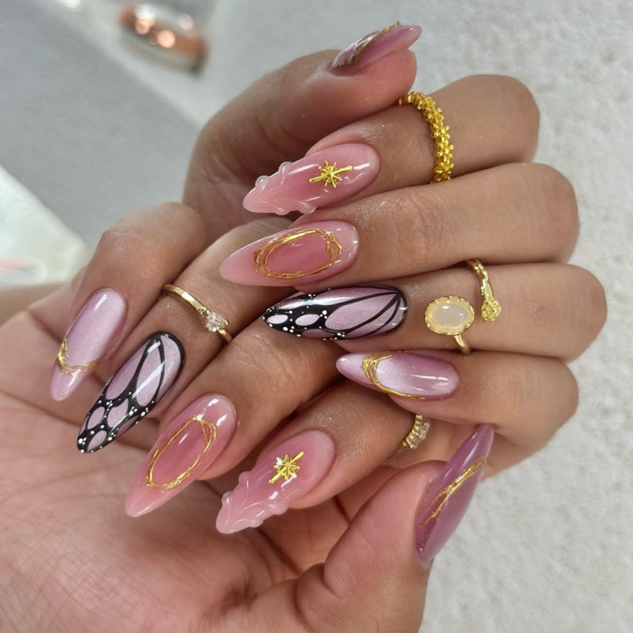Celestial Elegance Pink Long Almond Press-On Nail Set with Unique Gold Accents and Intricate Butterfly Design