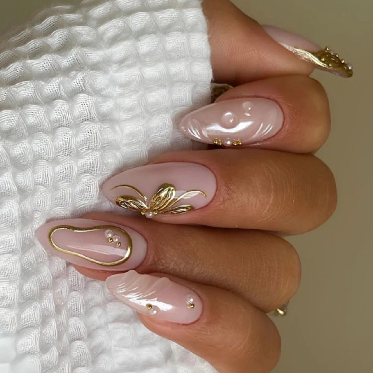 Bohemian Elegance Long Almond Baby Pink Press On Nail Set with Intricate Gold Floral Accents and Pearls