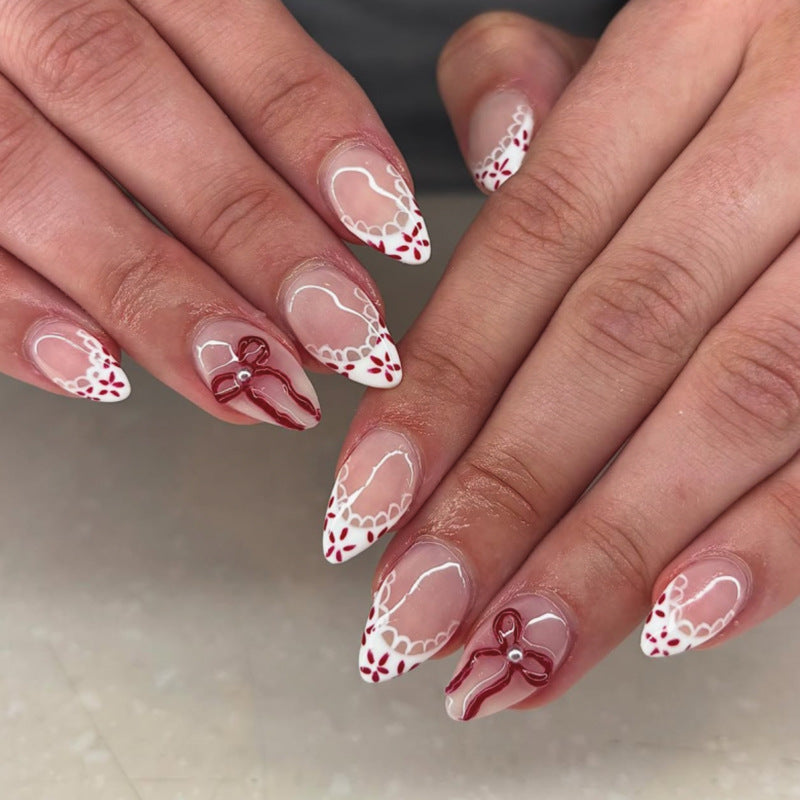 Festive Elegance Medium Almond Red and White Floral Design with Charming Bow Feature Press On Nail Set