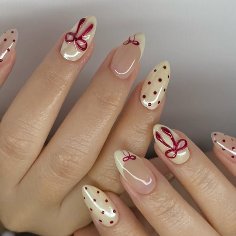 Charming Celebration Press On Nail Set Medium Almond Cream with Red Bows and Dots