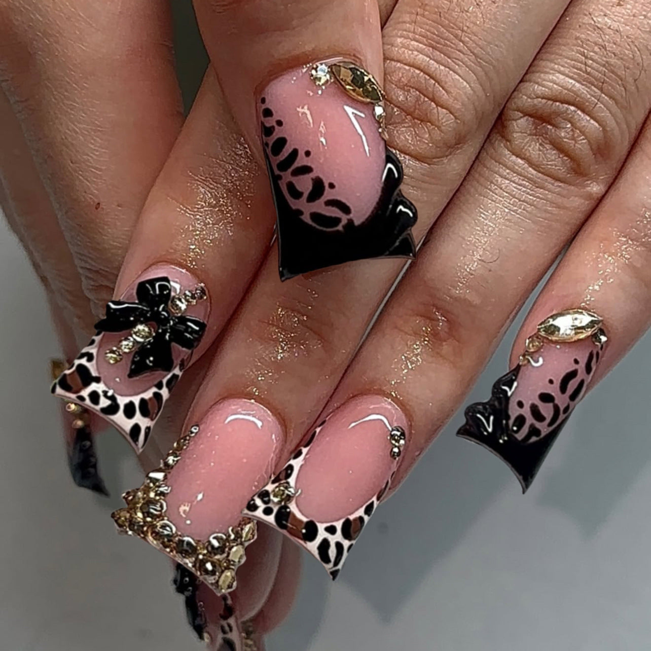 Glamorous Feline Twirl Long Duck Pink and Black With Luxurious Animal Print and Dazzling Gems Press On Nail Set