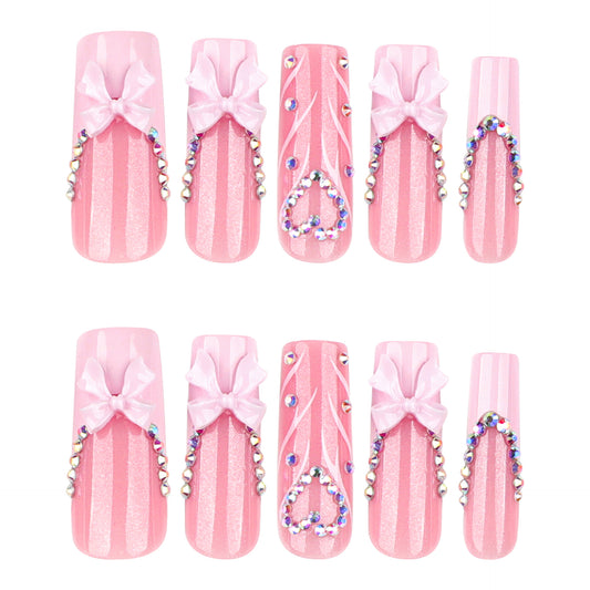 Enchanting Pink Dream Long Square Shaped Glimmering Pink Nails with Charming Ribbons and Sparkling Gems