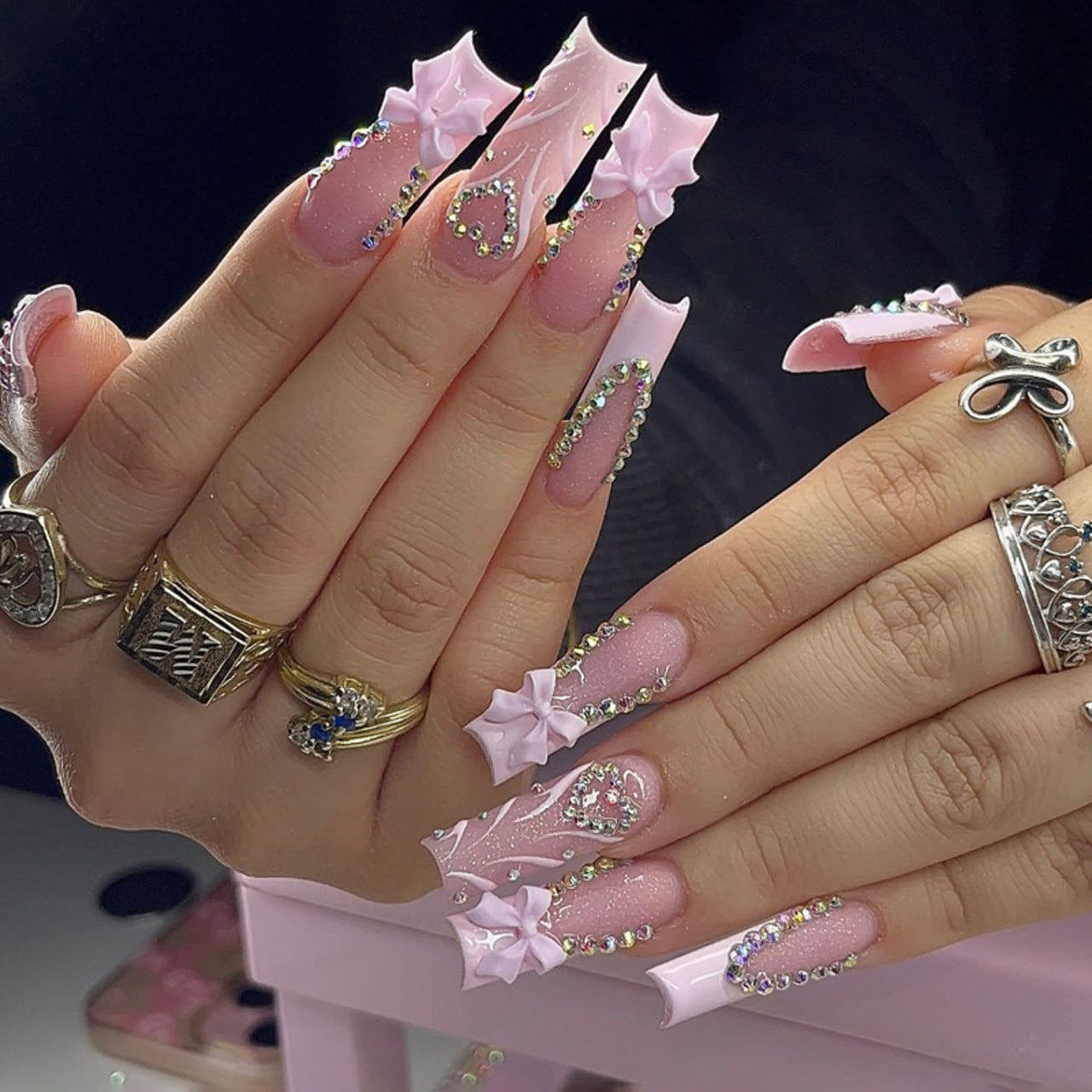 Dreamy Pink Starburst Long Square Press-On Nail Set with Glittering Gem Accents and Charming Bow Designs