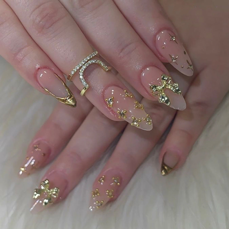 Glamorous Elegance Long Almond Shaped Beige with Gold Accents and Glittering Bow Details Press On Nail Set